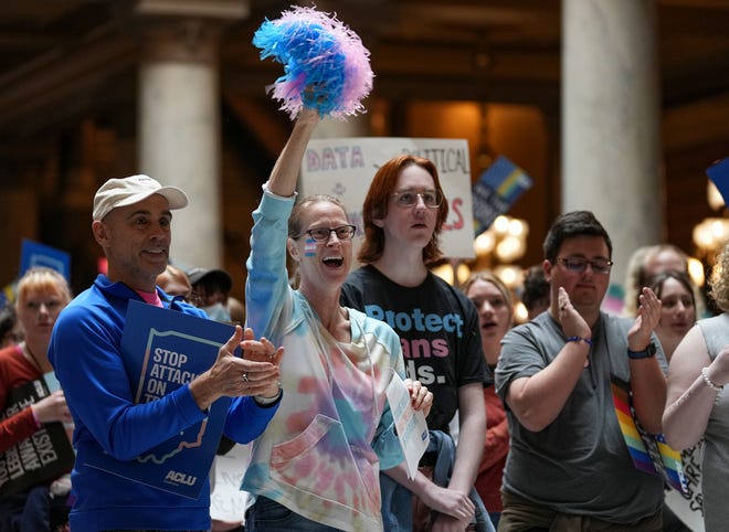 Jeff Stanley (left) and Julie Stanley cheer during a Rally to Protect Trans Youth organized by the ACLU of Indiana on Saturday, April 1, 2023, at the Statehouse in Indianapolis. Julie is the board president for GenderNexus and the couple has transgender children.
