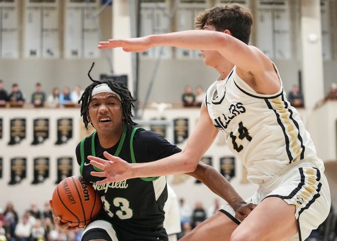 Westfield Shamrocks forward Durante Morton (33) rushes up the court against Noblesville Millers forward Hunter Walston (24) on Wednesday, Jan. 17, 2024, during the game at Noblesville High School in Noblesville. The Westfield Shamrocks defeated the Noblesville Millers, 58-54.
