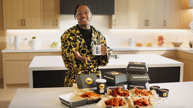 Actor, musician and TV host Nick Cannon stars in a new Buffalo Wild Wings promotion for its Buy One Get One Wing Deals on Tuesdays and Thursdays. The spot plays up the fact he is a father of 12.