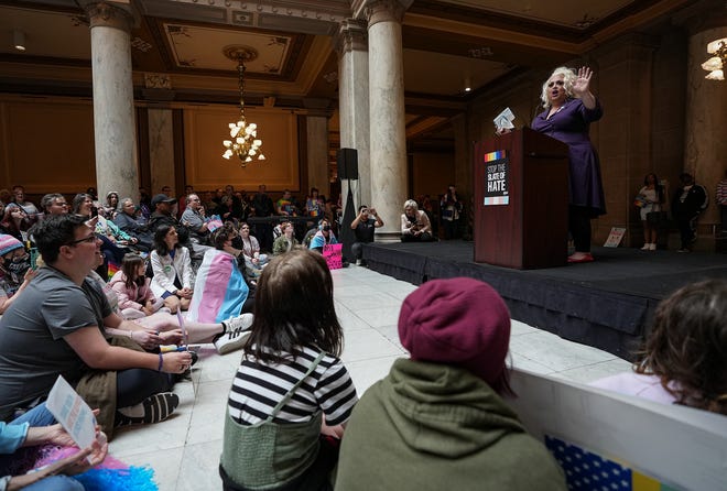 Drag performer Lola Palooza reads a book, "And Tango Makes Three," during a Rally to Protect Trans Youth organized by the ACLU of Indiana on Saturday, April 1, 2023, at the Statehouse in Indianapolis.