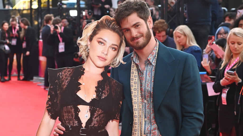 Andrew Garfield (R) poses with a cardboard cutout of Florence Pugh at the Headline Gala screening of "We Live In Time" during the 68th BFI London Film Festival at The Royal Festival Hall on October 16, 2024 in London, England.